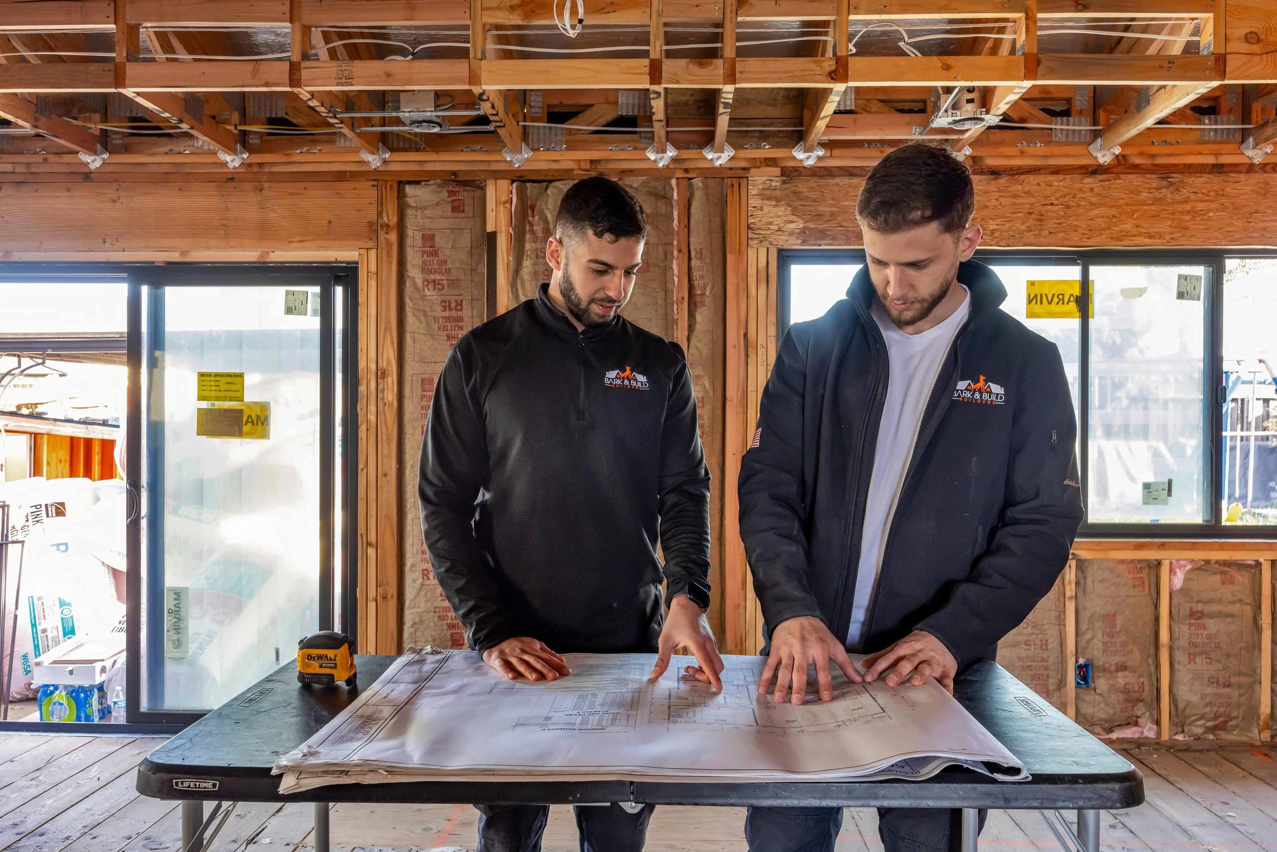 Bark & Build design and build team reviewing plans
