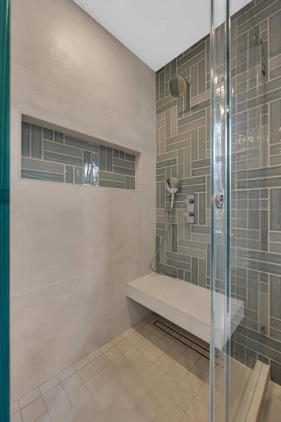 Stanford master bath — walk-in shower with vertical tile and niche