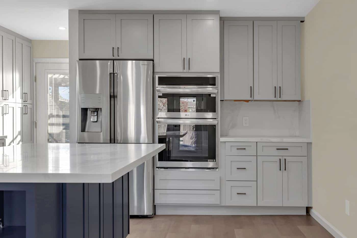 San Mateo kitchen — gray shaker cabinetry, fridge and double ovens