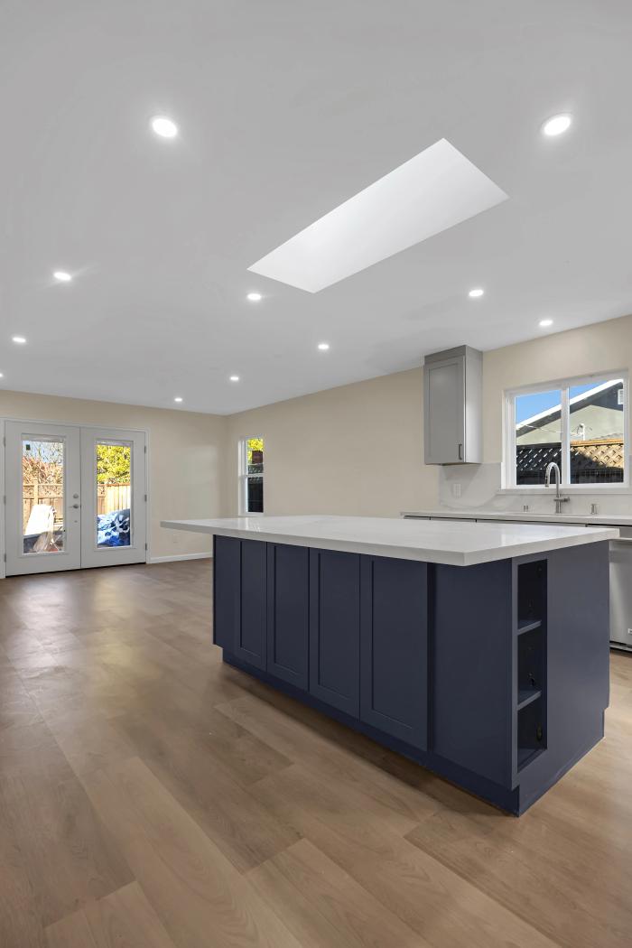 San Mateo kitchen remodel — navy island and French doors to the backyard