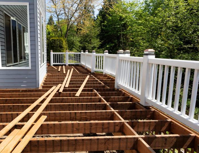 Deck rebuild — joists exposed and reinforced