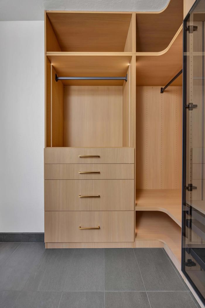 San Francisco master closet — glass-door cabinets