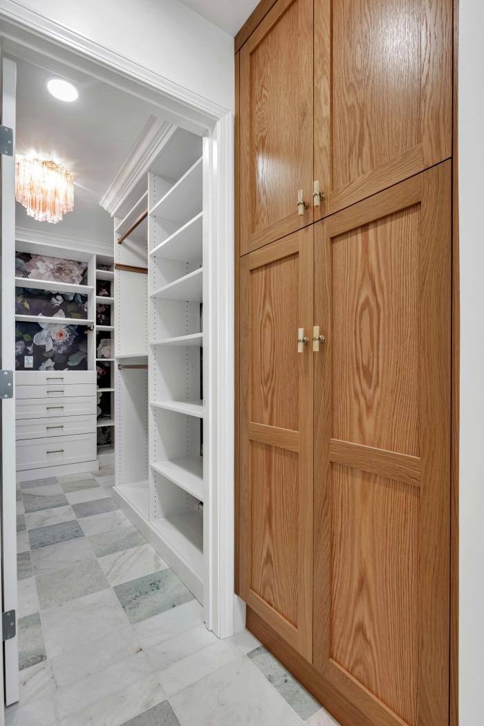 San Carlos walk-in closet — dark floral bays and shelving
