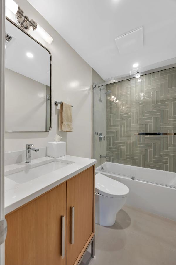 Stanford master bath — vanity under the sloped ceiling