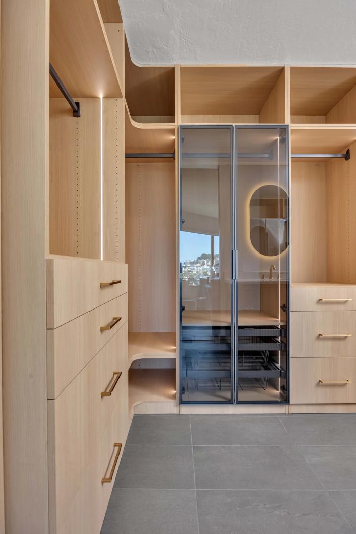 San Francisco master closet — smoked glass cabinets