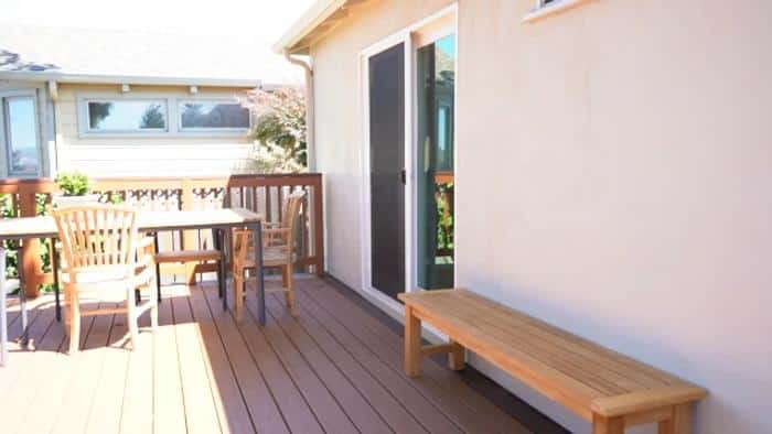 TREX deck — sliding-door access and bistro seating
