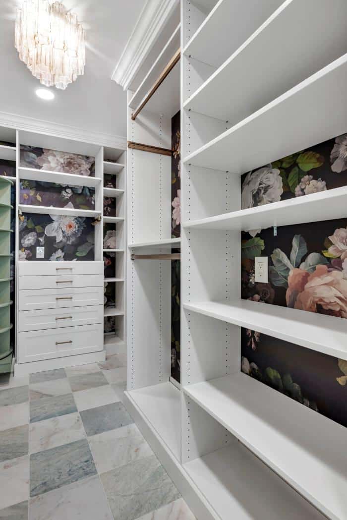 San Carlos walk-in closet — floral backdrop with framed art