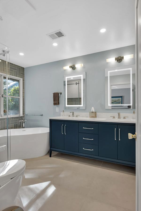 Stanford master bath — navy double vanity with twin mirrors
